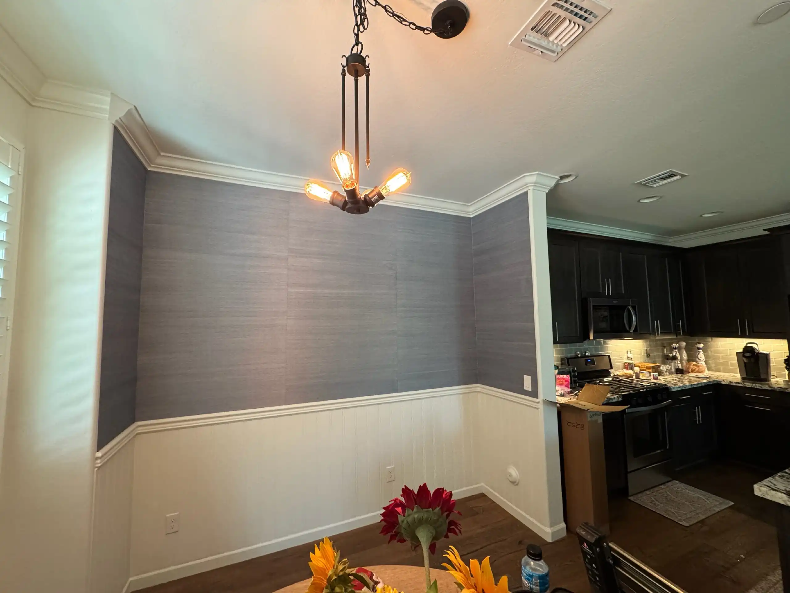Orange Cove kitchen with accent wallpaper backsplash area