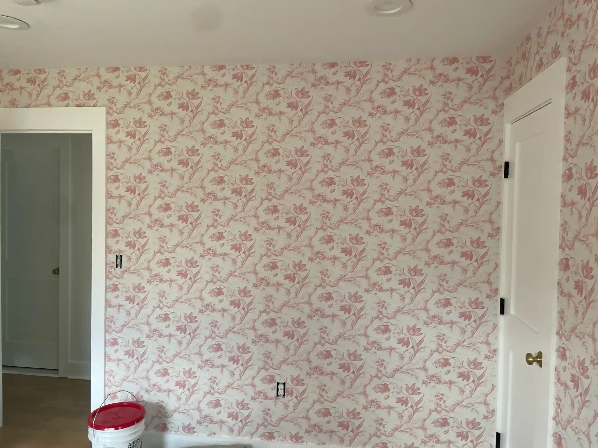 Parlier bedroom feature wall with patterned wallpaper